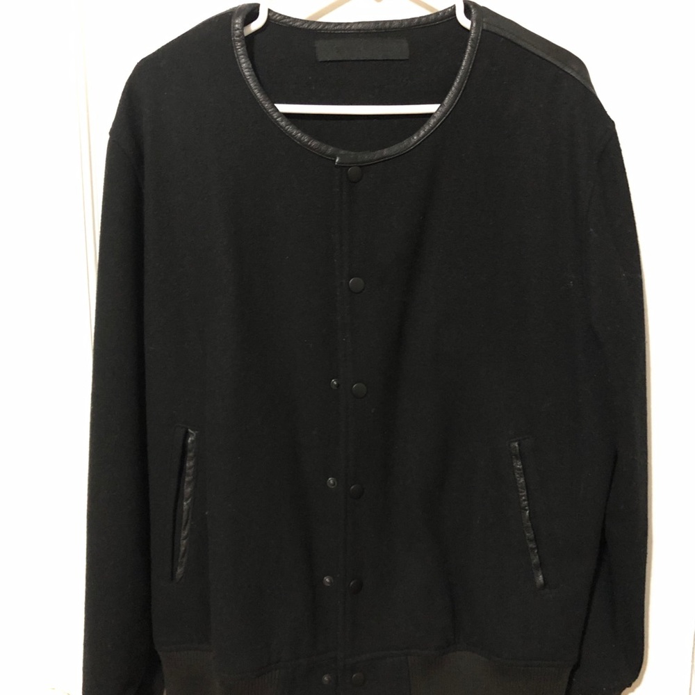 Black scale jacket, wide collar, leather back.
